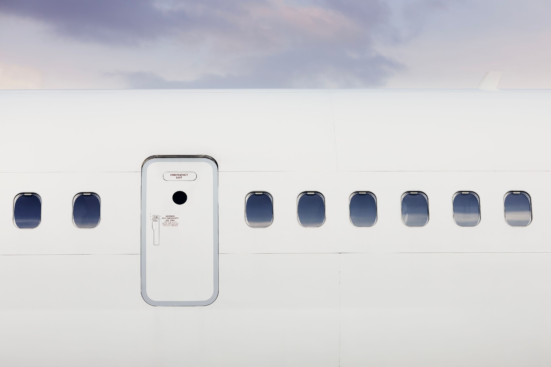 Fuselage of airplane against moody sky